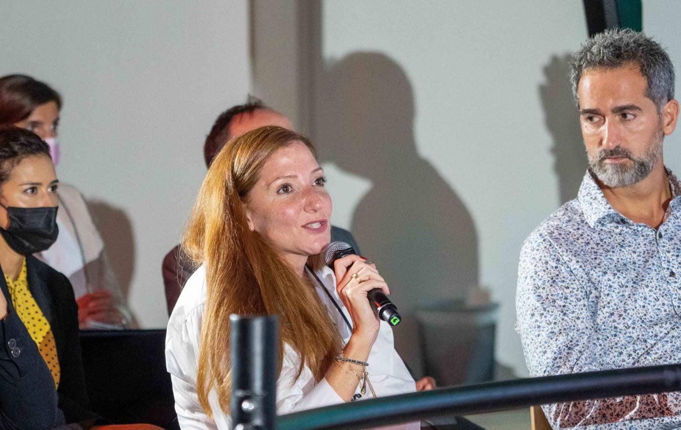 A participant speaking from the audience