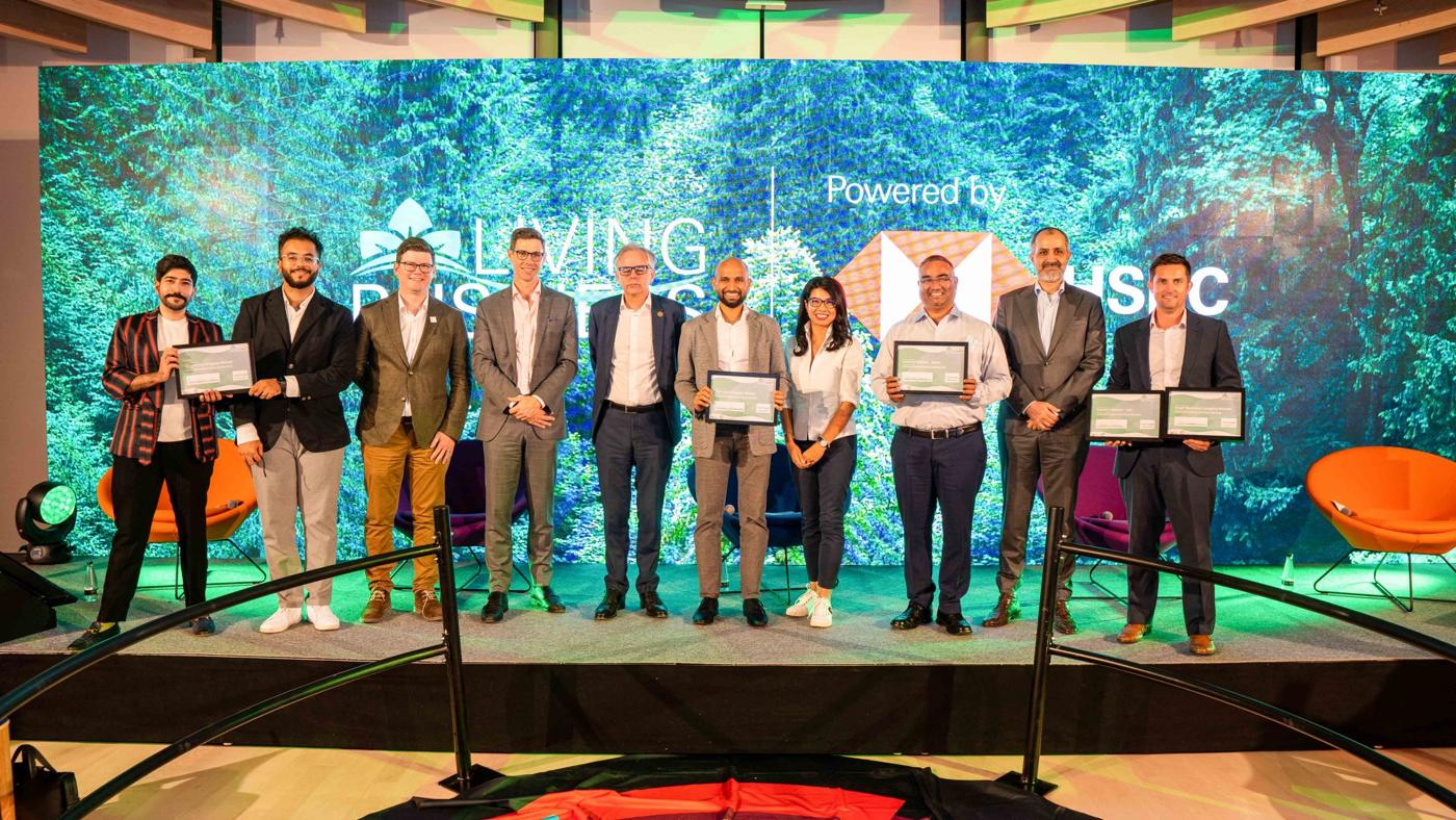 Programme winners on stage holding their certificates